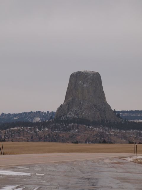 Devils Tower, a volcanic formation in Wyoming, as seen from a distance across the valley. [Credit: moi]