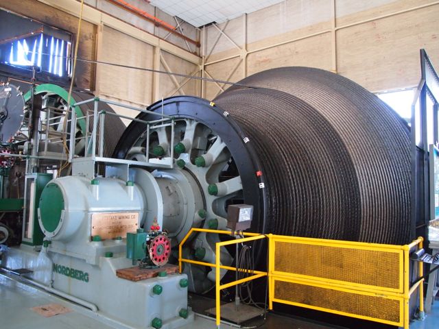 The winch and cable mechanism controlling the "cages": the elevators that provide access to the lower levels of the Sanford Underground Research Facility in Lead, South Dakota. [Credit: moi]