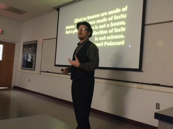 The problem with claiming to know something is that people take you seriously sometimes. Here I am speaking at the astronomy department at New Mexico State University about science communication. [Credit: Meredith Rawls]